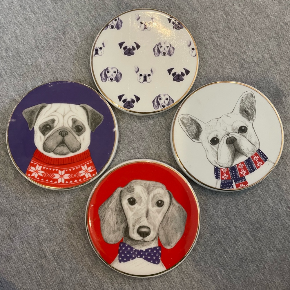 Four ceramic dog coasters